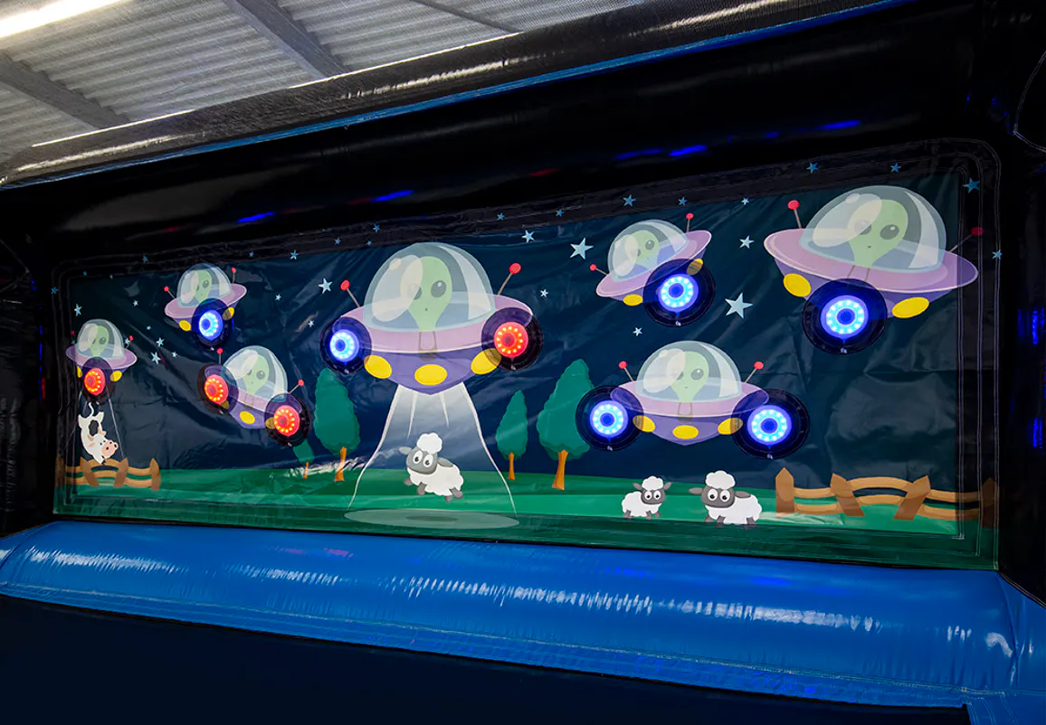 Alien-themed illuminated target panel in the IPS Shooting Gallery