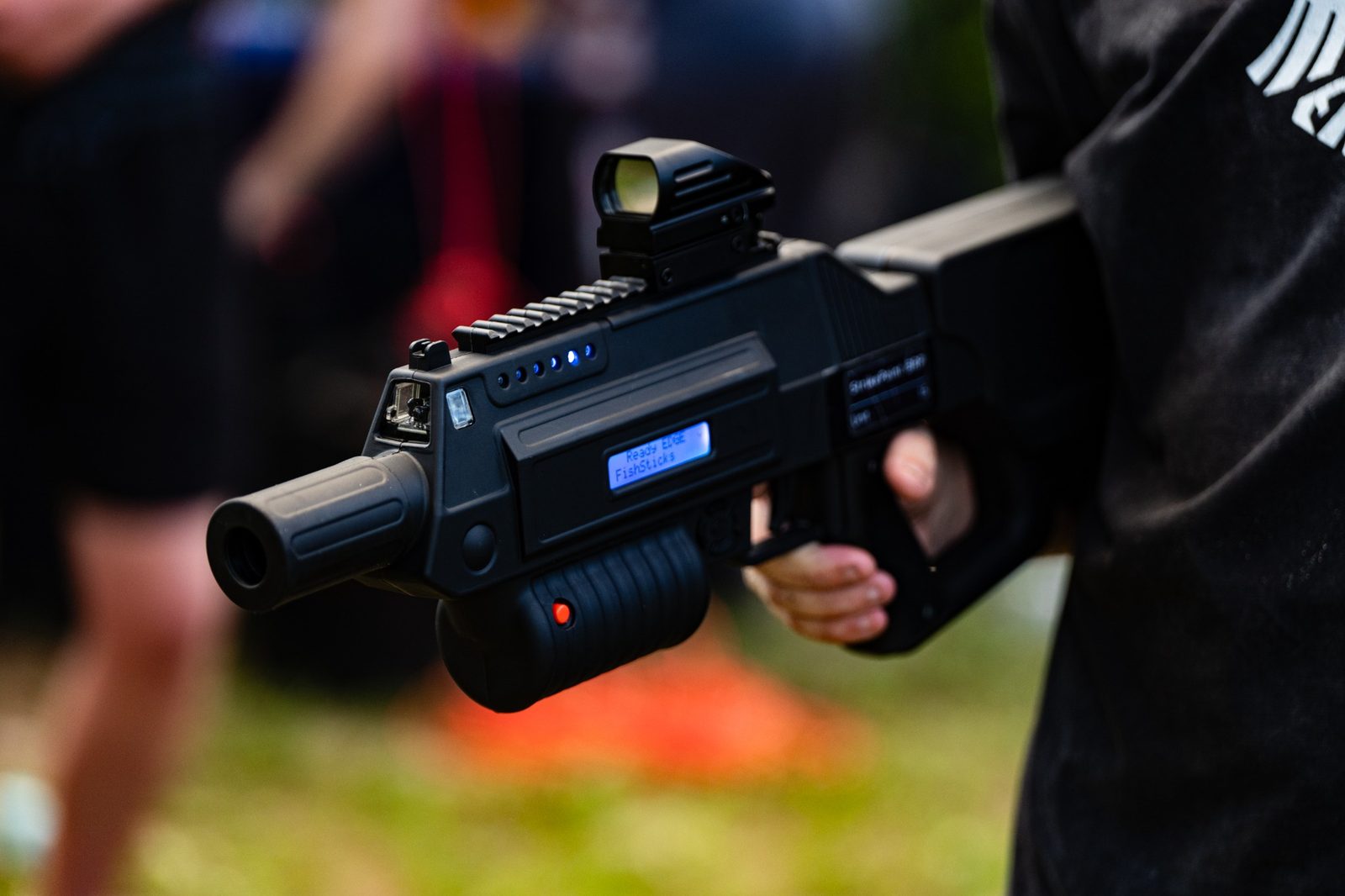 Close-up of a professional laser tagger with an illuminated display
